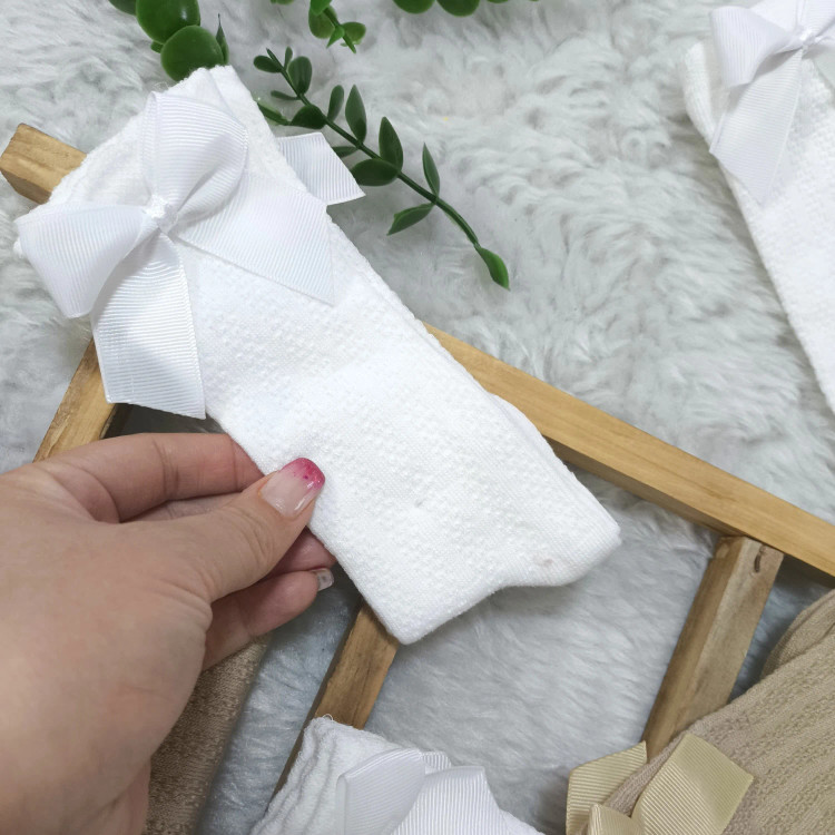 جوراب نخی نیم ساق دخترانه طرح گندمی با پاپیون (مناسب 6 ماه تا 6 سال)